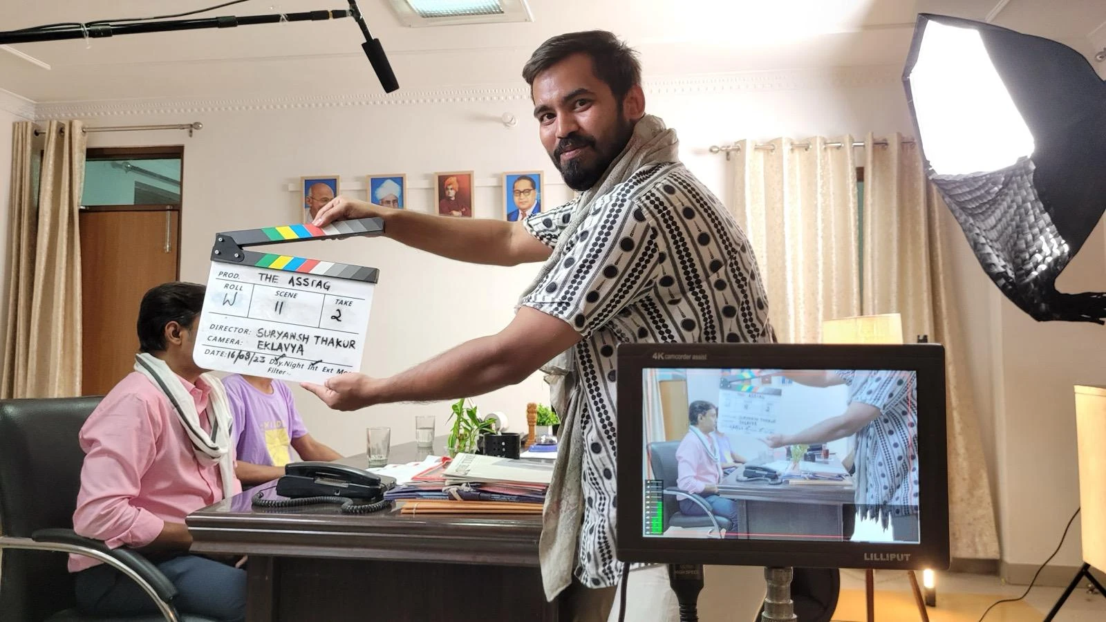 The Eknetra crew slates a scene in an office set